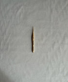 Small thermometer on a textured gray surface