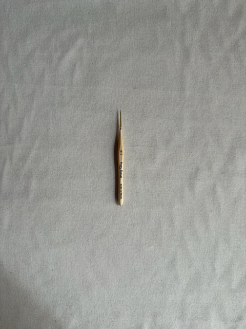 Small thermometer on a textured gray surface